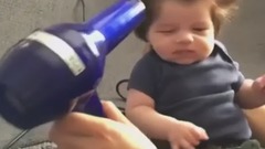 Nine-week-old baby has full head of bouffanthair