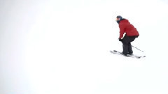 Foreign brother freestyle skiing in winter snow