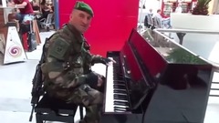 The soldier saw a piano at the Paris airport. And then it's out of hand